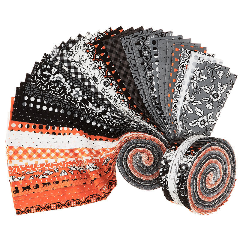 Midnight Magic 2 jelly roll by April Rosenthal for Moda Fabrics, fanned out showing orange, black, white, and gray Halloween prints