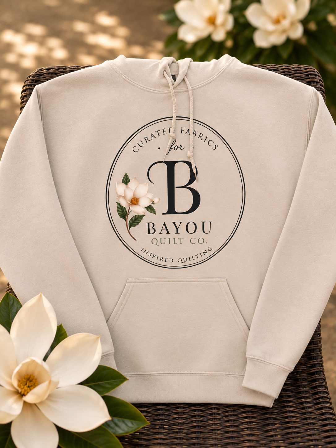 Bayou Quilt Co. hooded sweatshirt with round seal logo, available in Old Gold and Sand