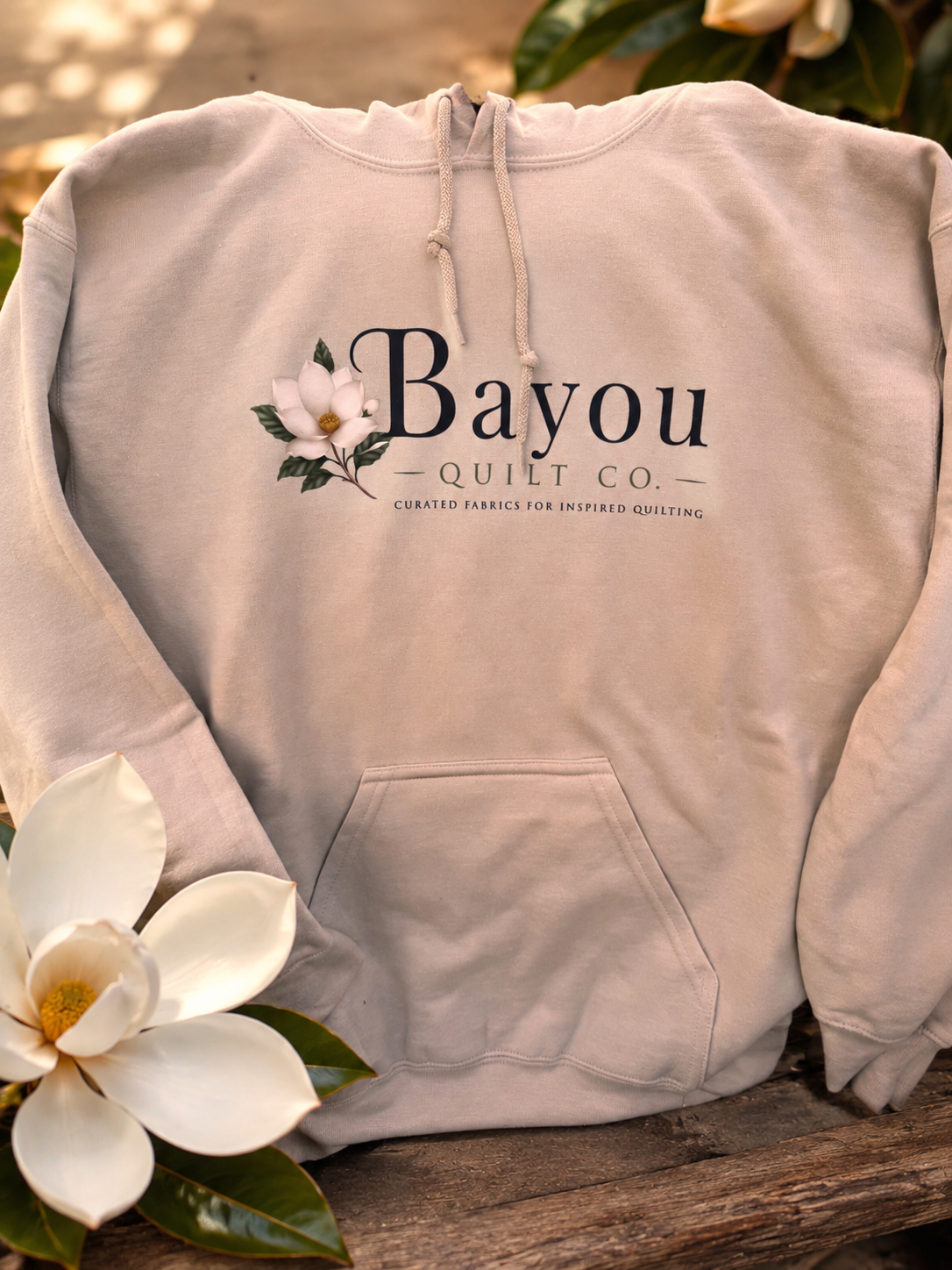 Bayou Quilt Co. hooded sweatshirt with horizontal logo, available in Old Gold and Sand