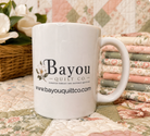 Bayou Quilt Co. coffee mug with horizontal wordmark logo and website