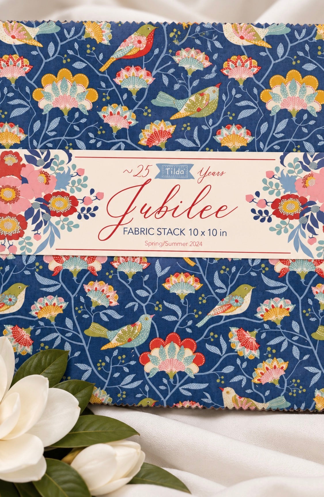 Tilda Jubilee 10-Inch Squares Layer Cake, 40 piece fabric pack in a circus-inspired palette of blues, reds, teals, and golds